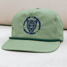 Green cap with a leopard logo and text on a light background